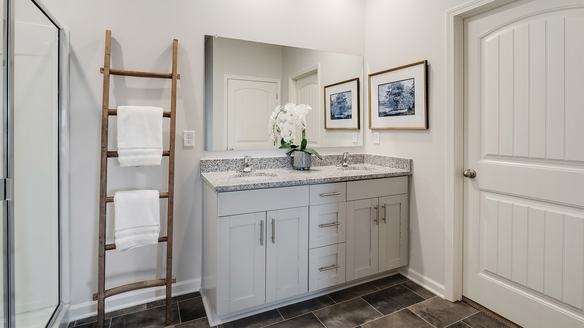 Owner’s ensuite in a new build home offers function and style with a walk-in closet, spa-like ensuite