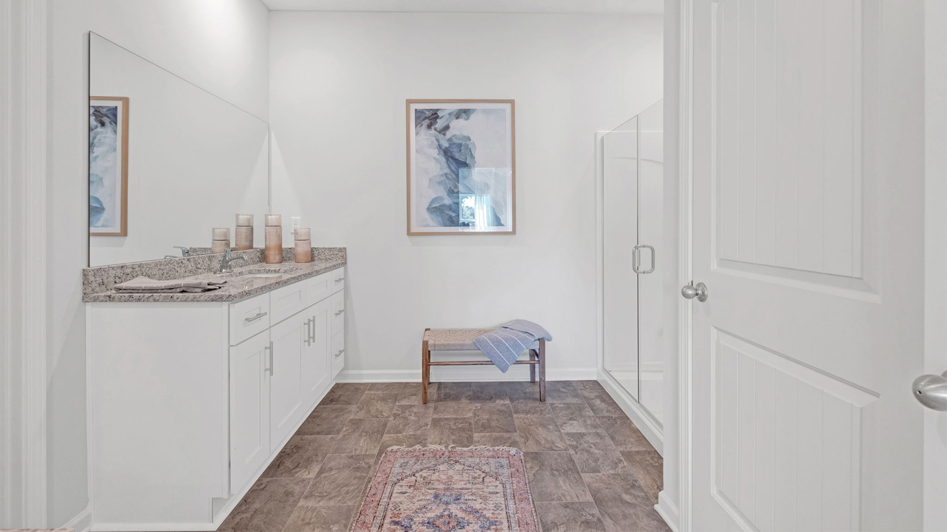EN suite primary bathroom with a privacy bathroom and an additional linen closet