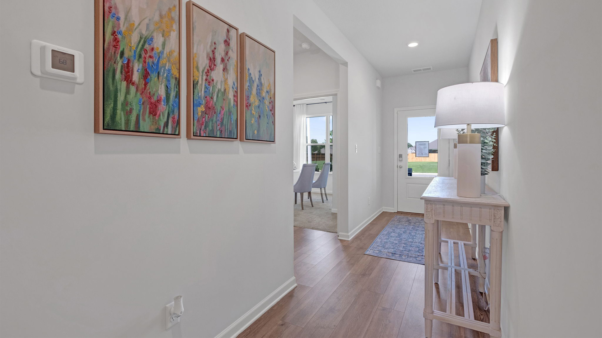 Long entryway hallway leading into the secondary bedrooms
