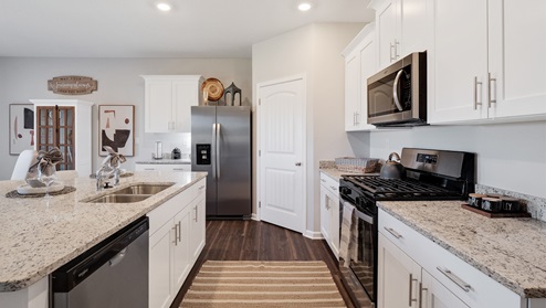 Kitchen area with granite countertops