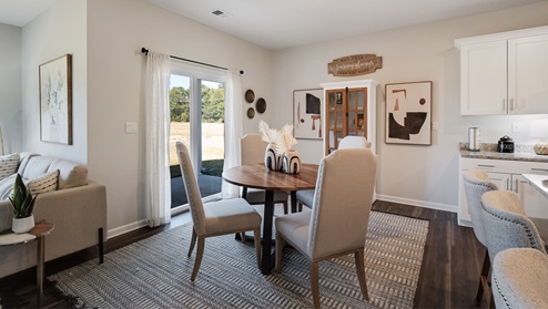 Dining area with door access out to covered patio