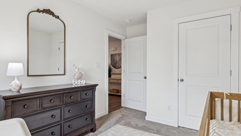 Third bedroom with neutral walls and carpet flooring