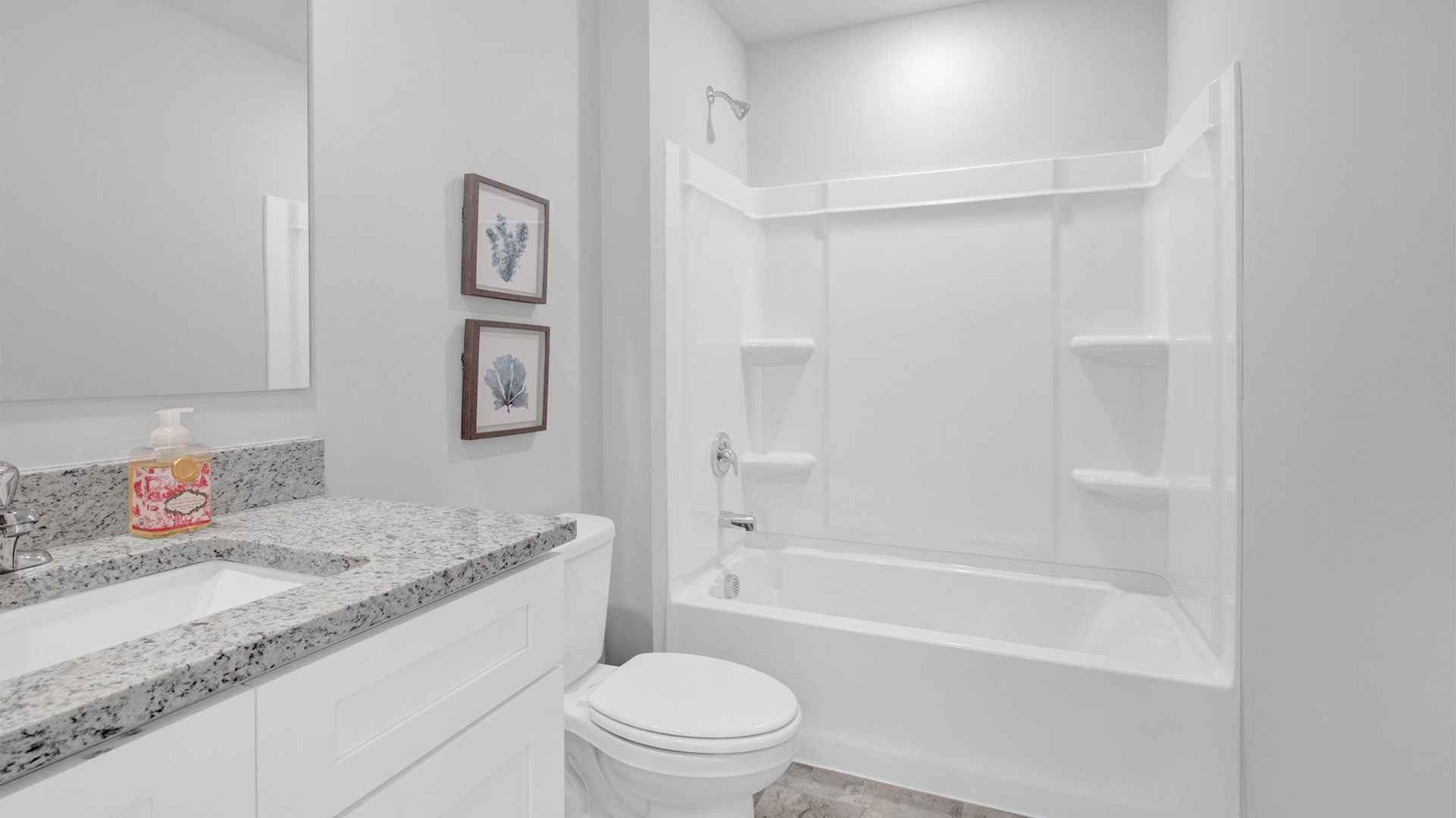 GUest bathroom with an acrylic tub/shower insert