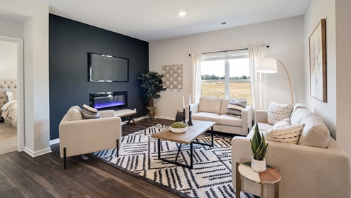 Spacious living room with a large backwall window