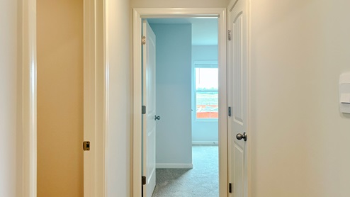 Garage door entry hall leading into the laundry room