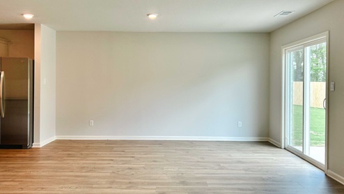 Dining room with door access out to covered patio