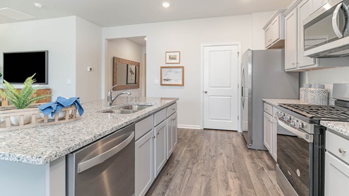 Kitchen area with granite countertops