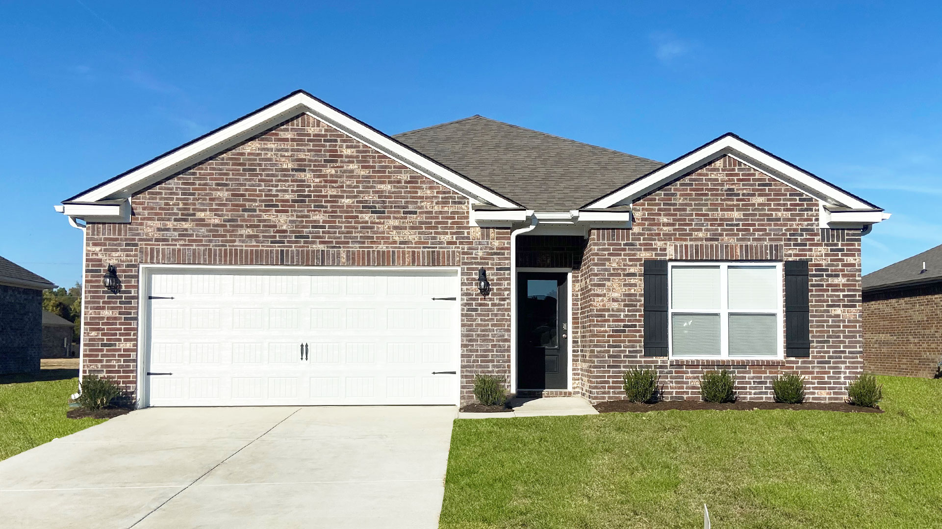 Exterior of our Aria F elevation with beautiful brick on the front of the home