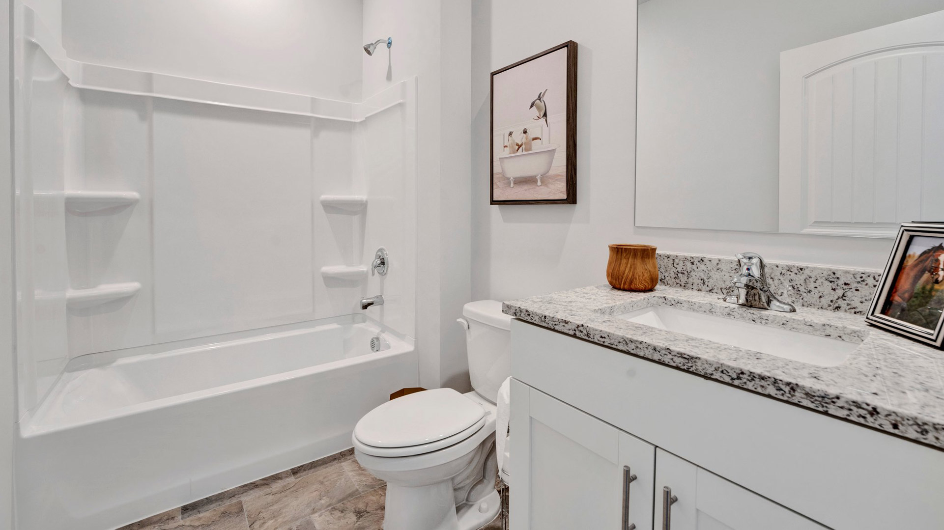 Second bathroom with a single vanity and an acrylic tub/shower insert