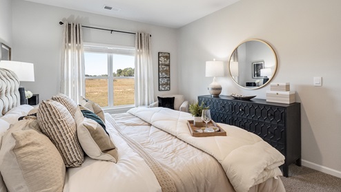 Primary bedroom comfortably fits a king size bed