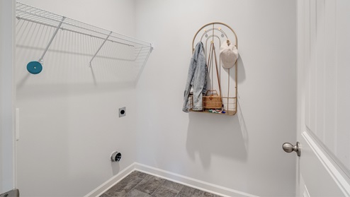 Laundry room with ventilated shelving