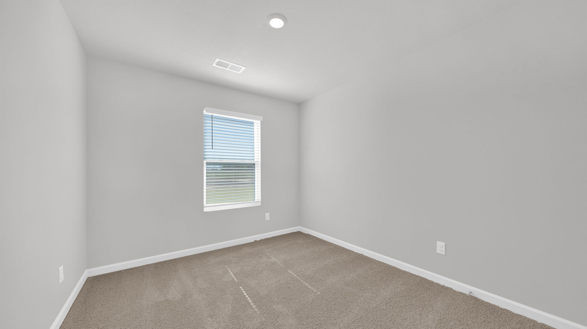 Second bedroom at the front of the home overlooking the front yard