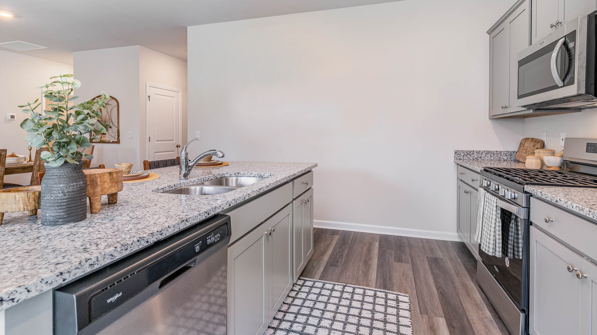 Interior kitchen with grey cabinets and island
