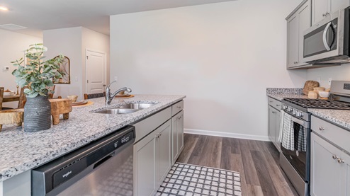 Kitchen area with granite countertops