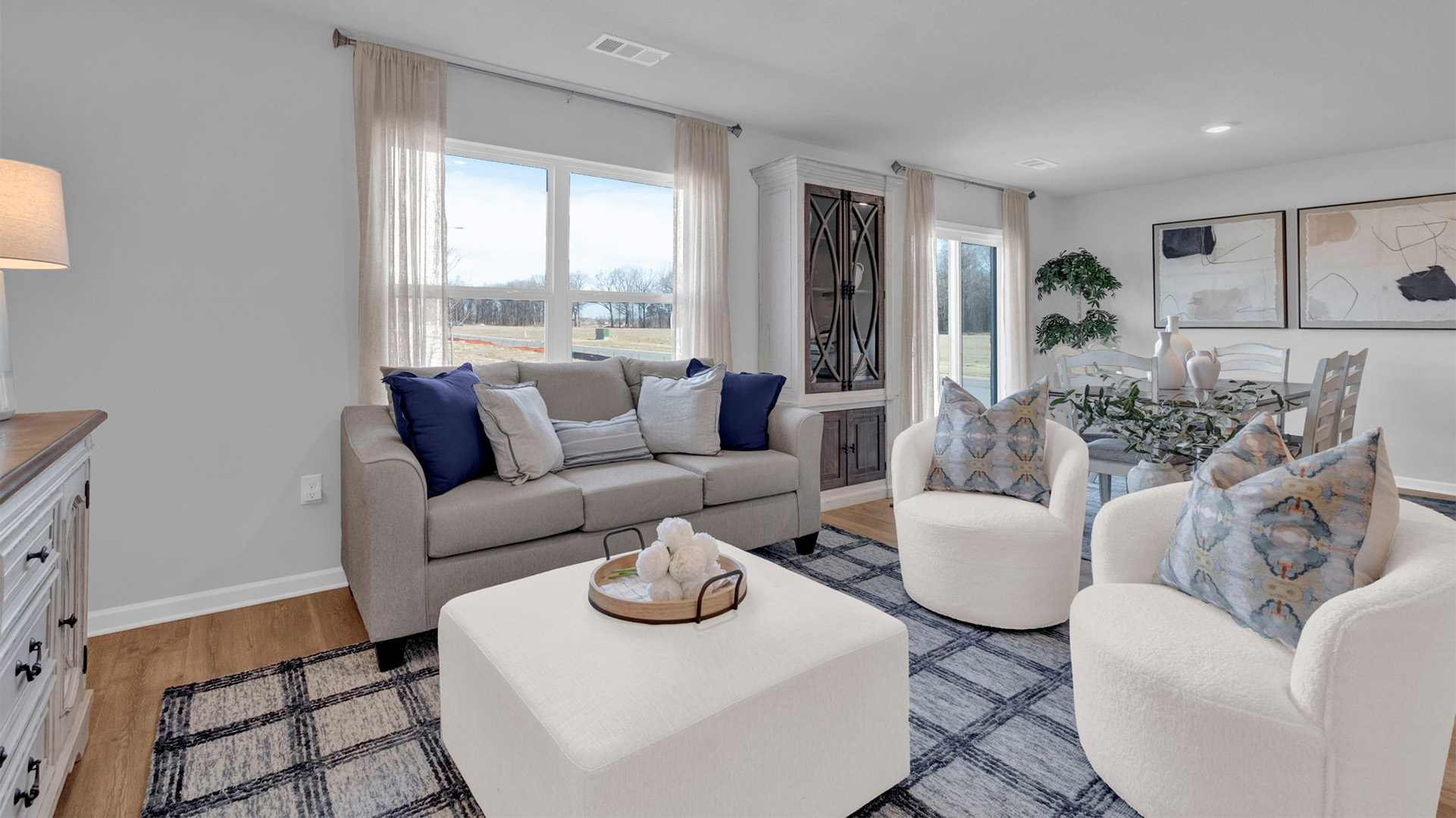 Living room with a double window overlooking the backyard