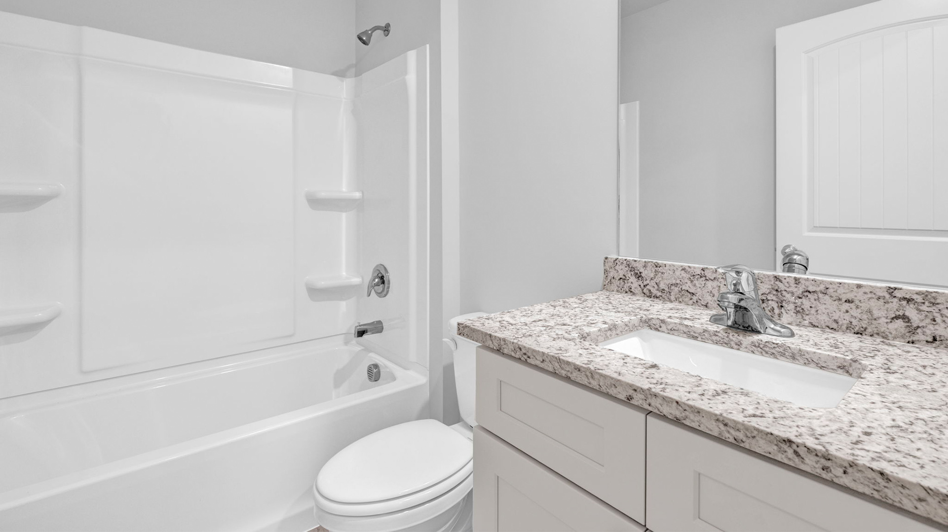 Guest bathroom with an acrylic tub/shower insert