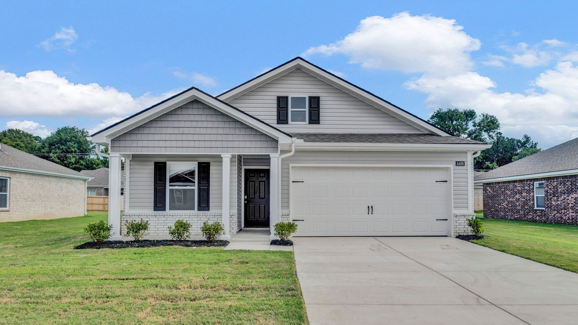 Exterior of the Roland floorplan, a single story home with a two car garage