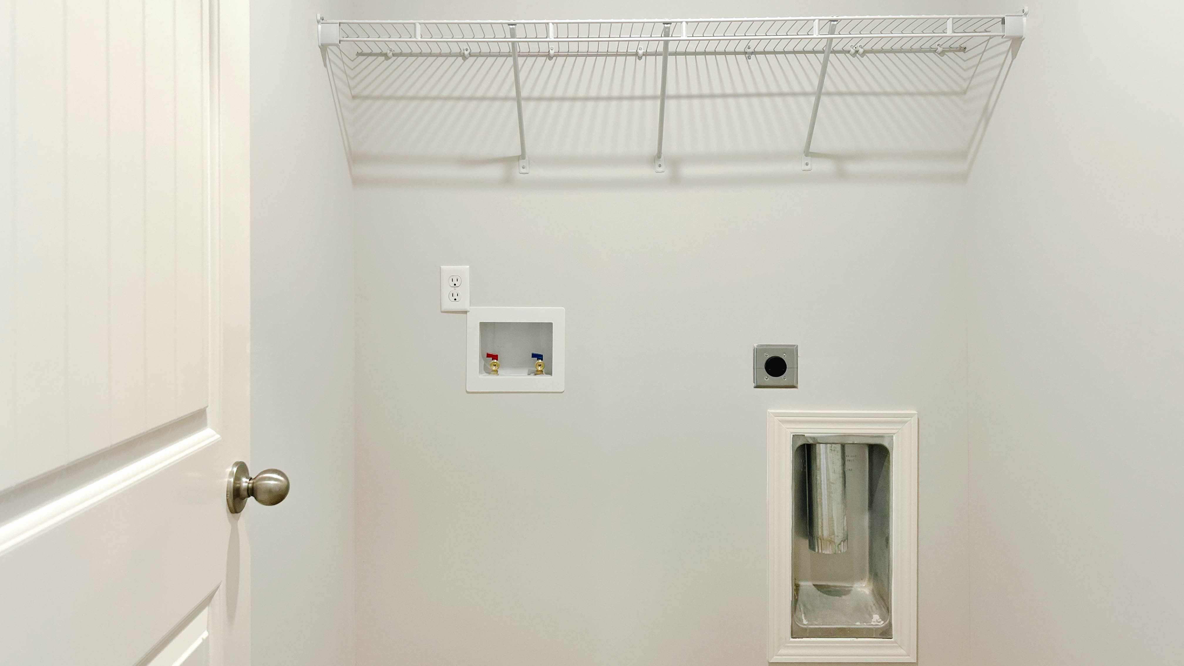 Laundry room with ventilated shelving
