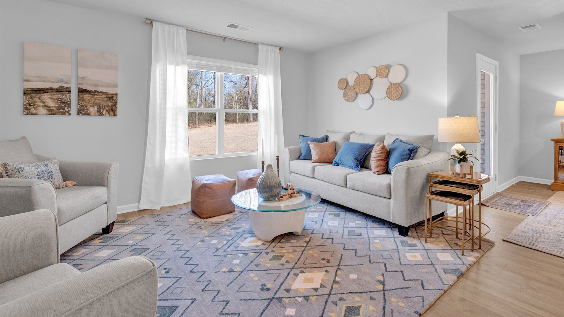 Living room with vinyl flooring and neutral paint