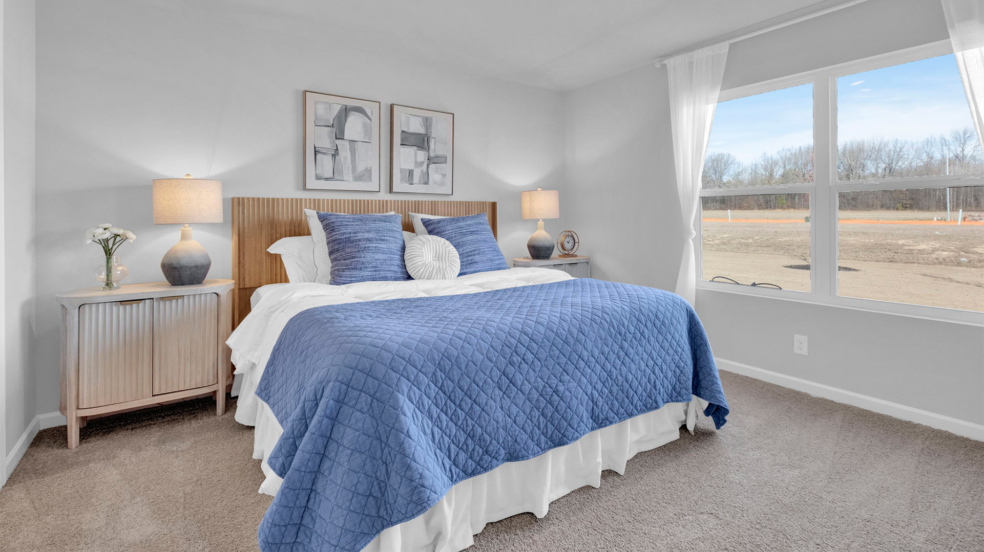 Beautiful primary bedroom comfortably fits a king size bed