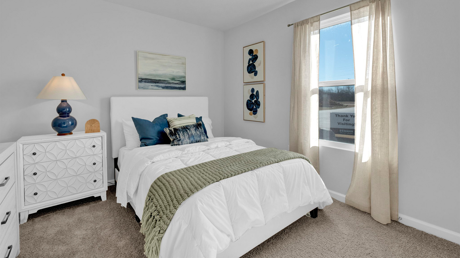 Bedroom two with carpet flooring and neutral paint