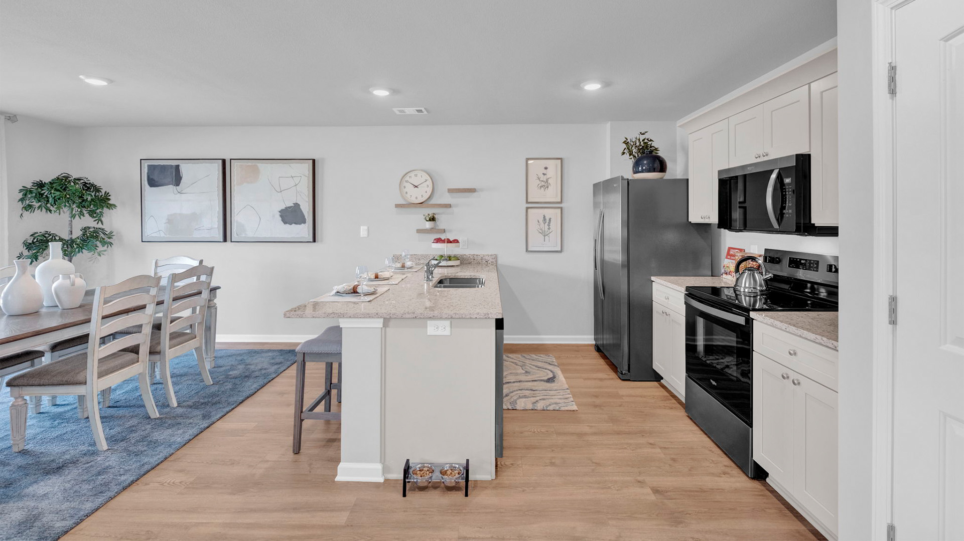 Open concept view of the kitchen overlooking the dining room