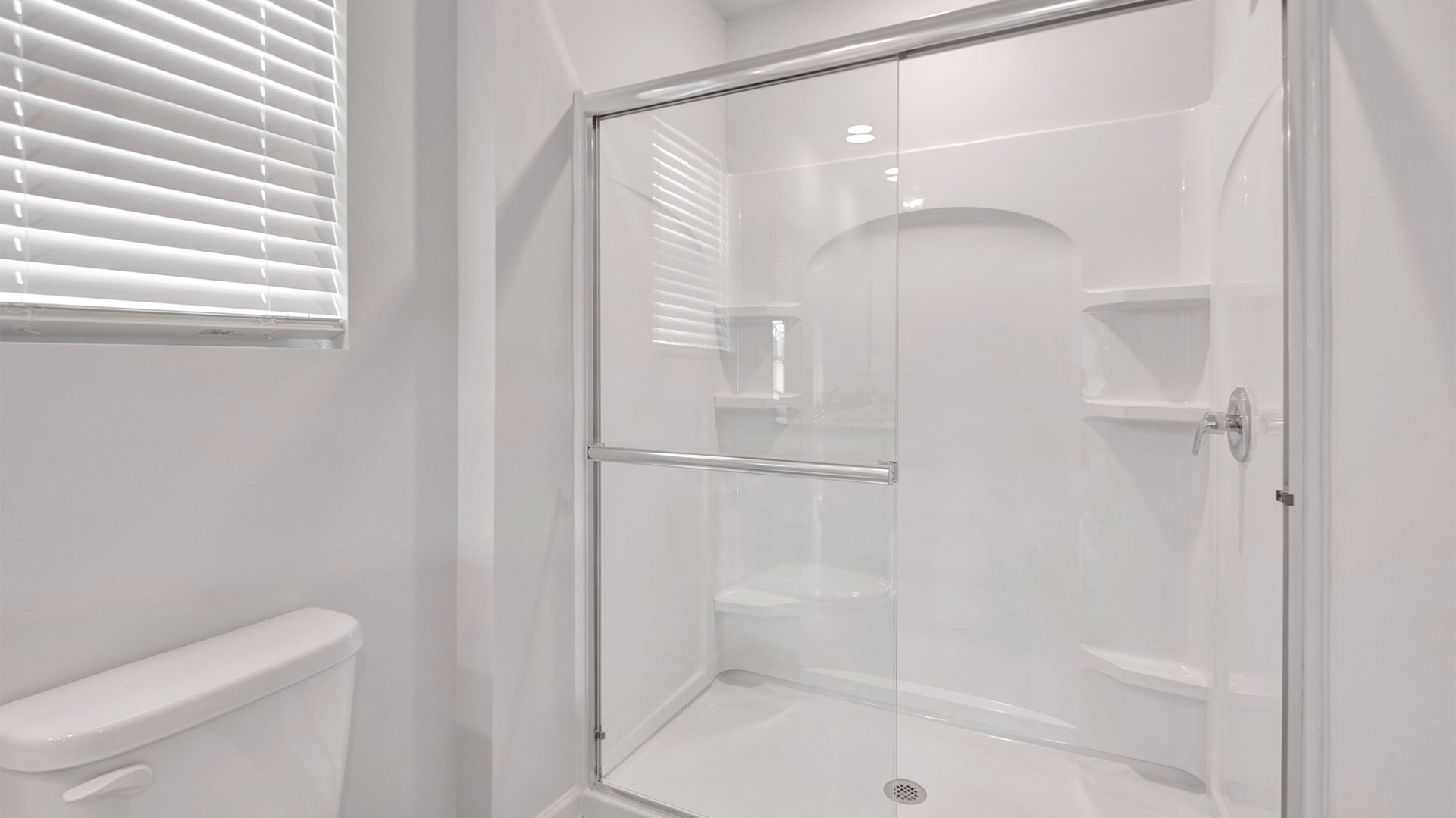 Primary bathroom with a glass enclosed walk in shower