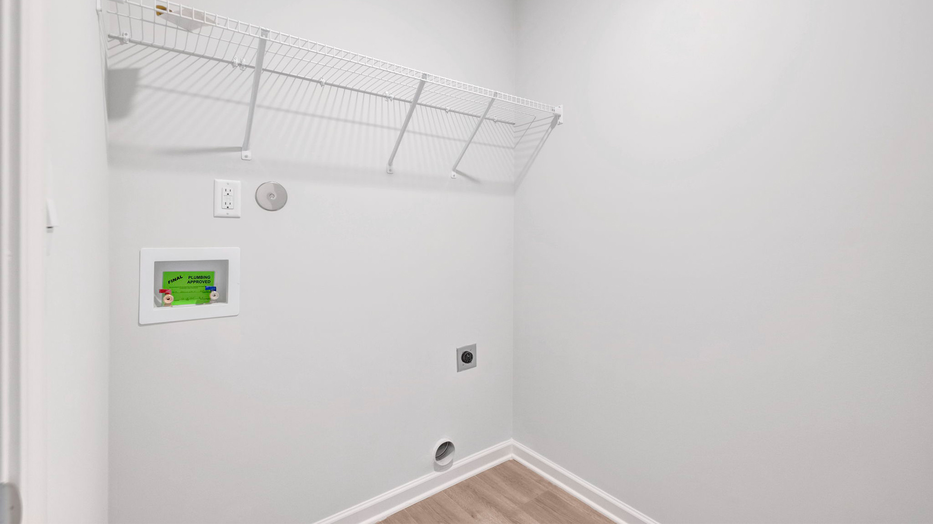 Laundry room with ventilated shelving