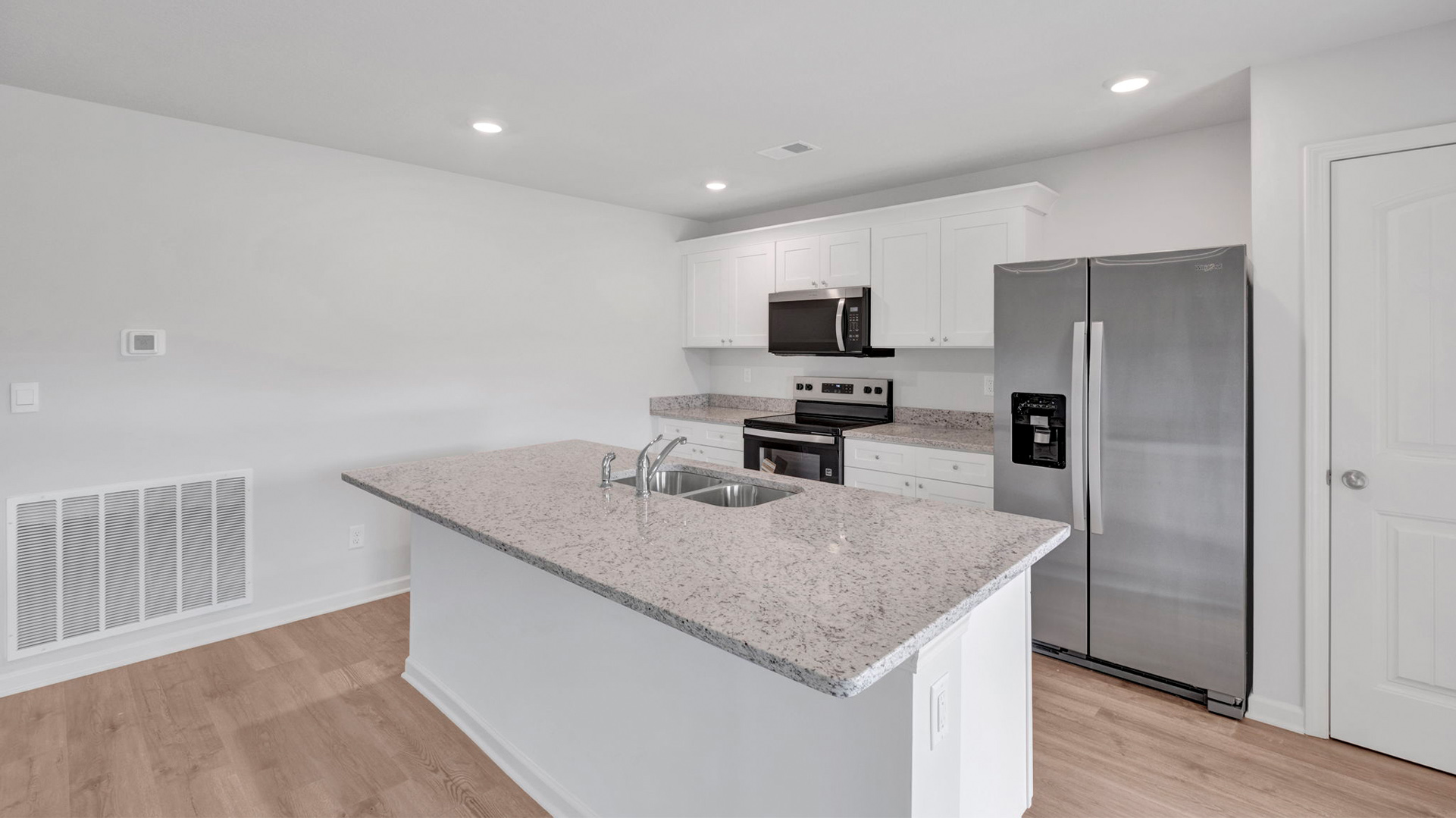 Kitchen area with a walk in pantry with ventilated shelving