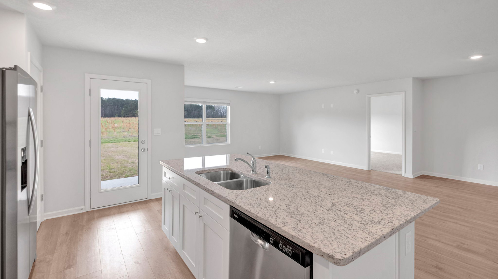 Spacious kitchen island overlooking the living and dining room