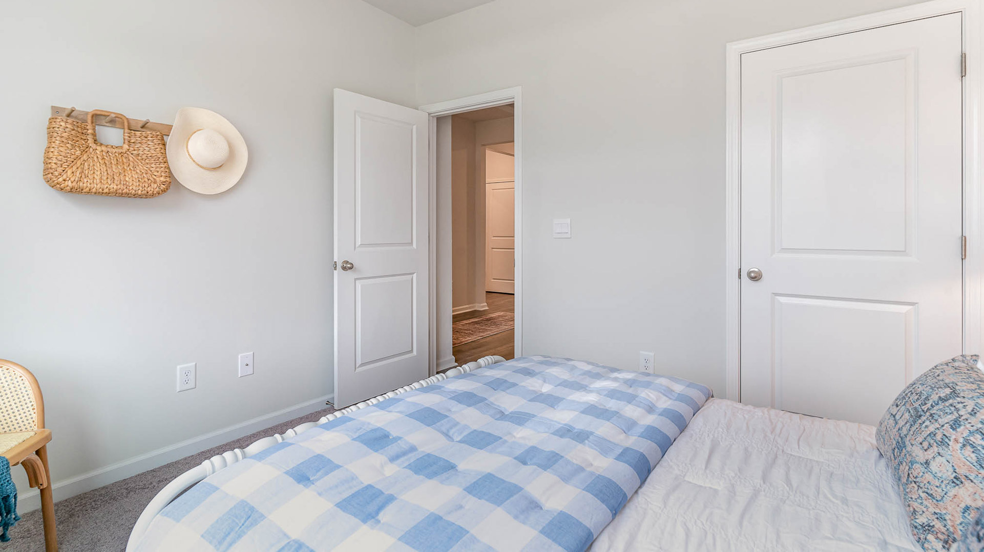Second bedroom with carpet flooring and neutral walls