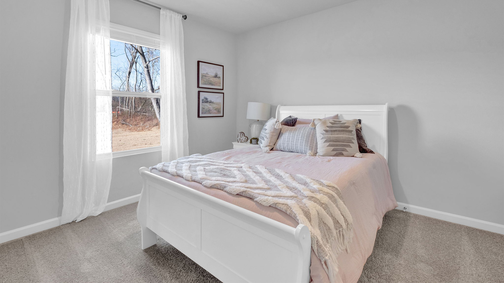 Second bathroom with a full size bed and additional bedroom furniture