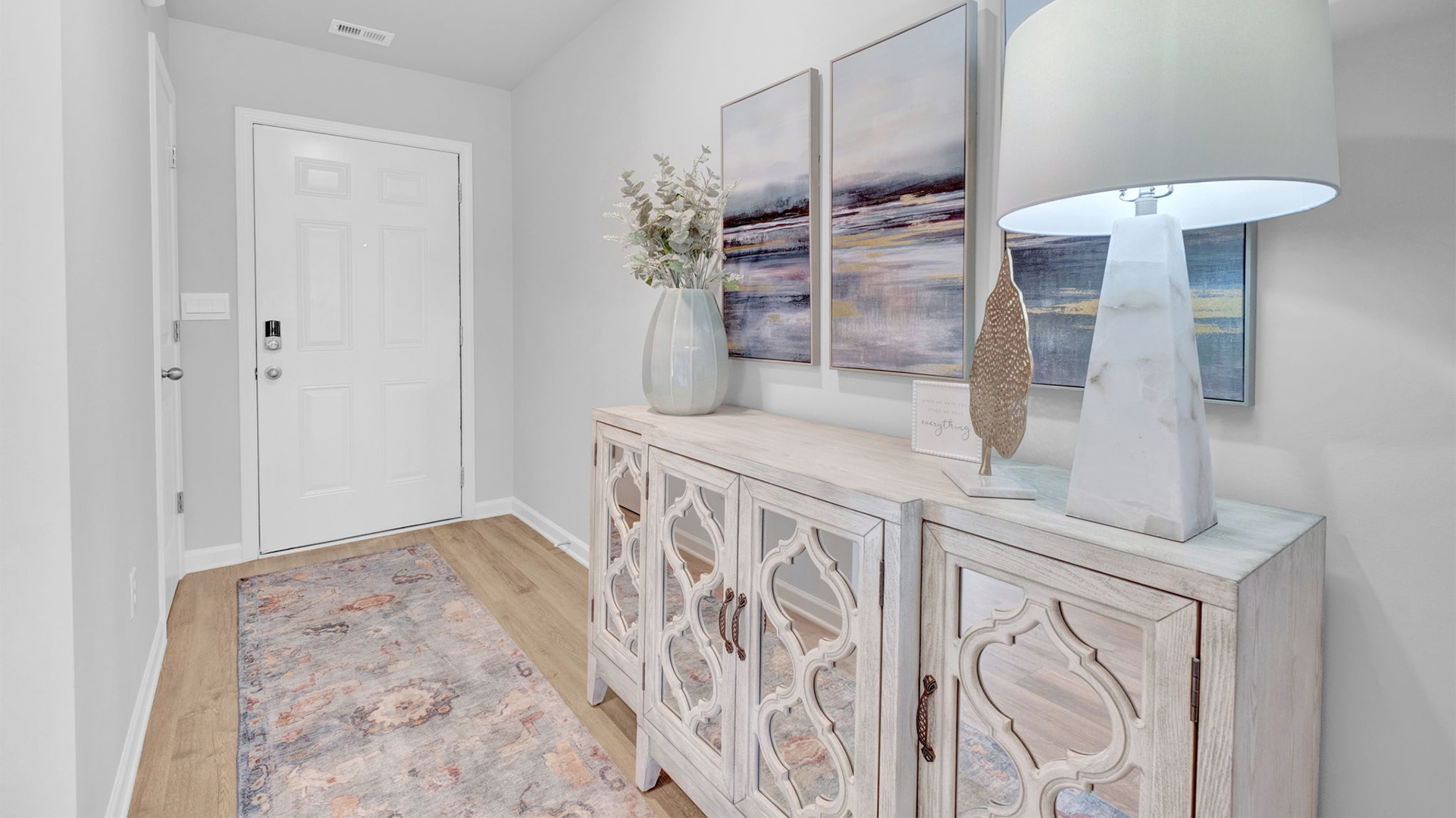 Front door entryway of the Cali with beuatiful recessed lighting as you enter through the front door