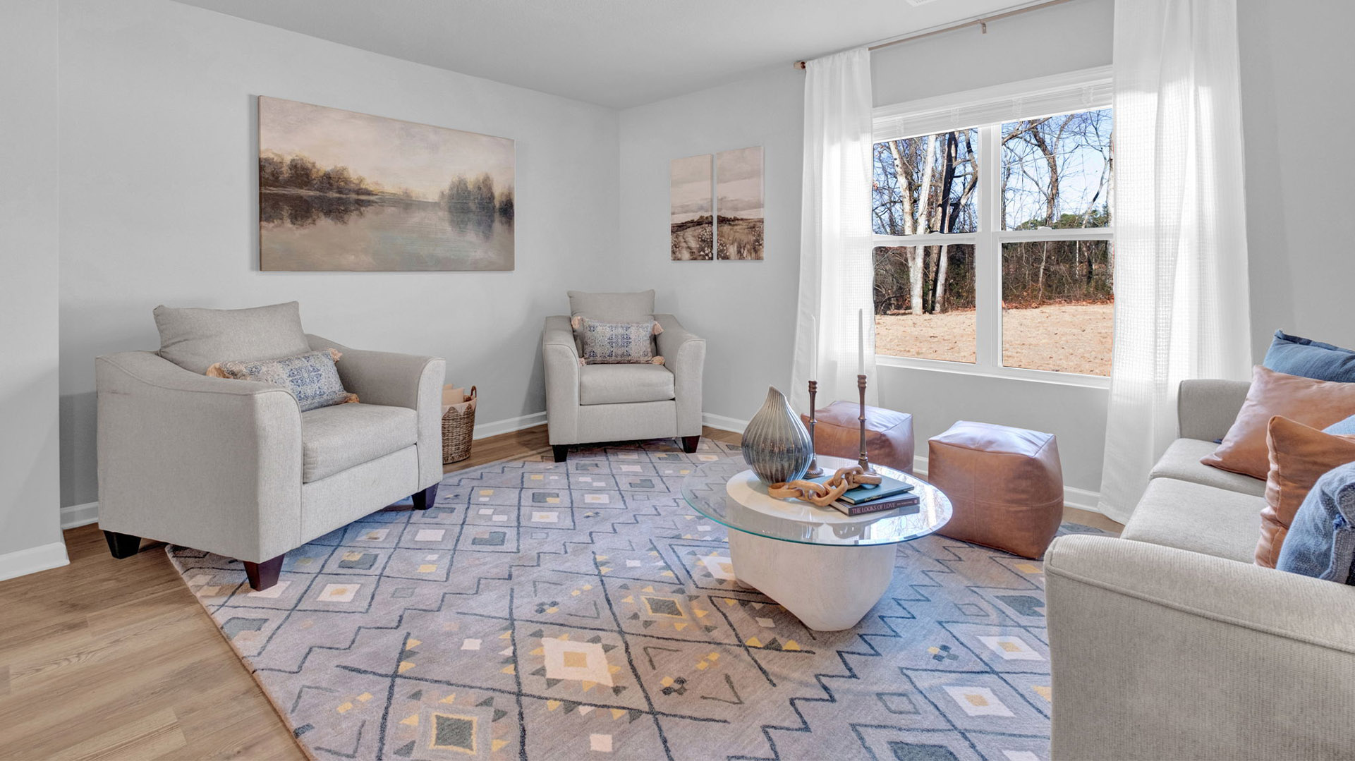 Living room with a double window overlooking the backyard