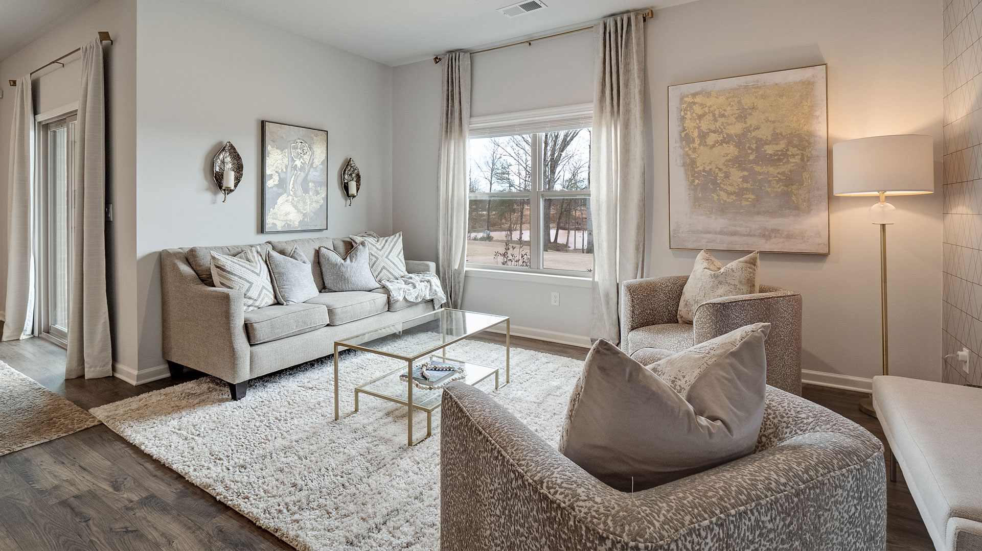 Living room area with vinyl flooring and neutral walls