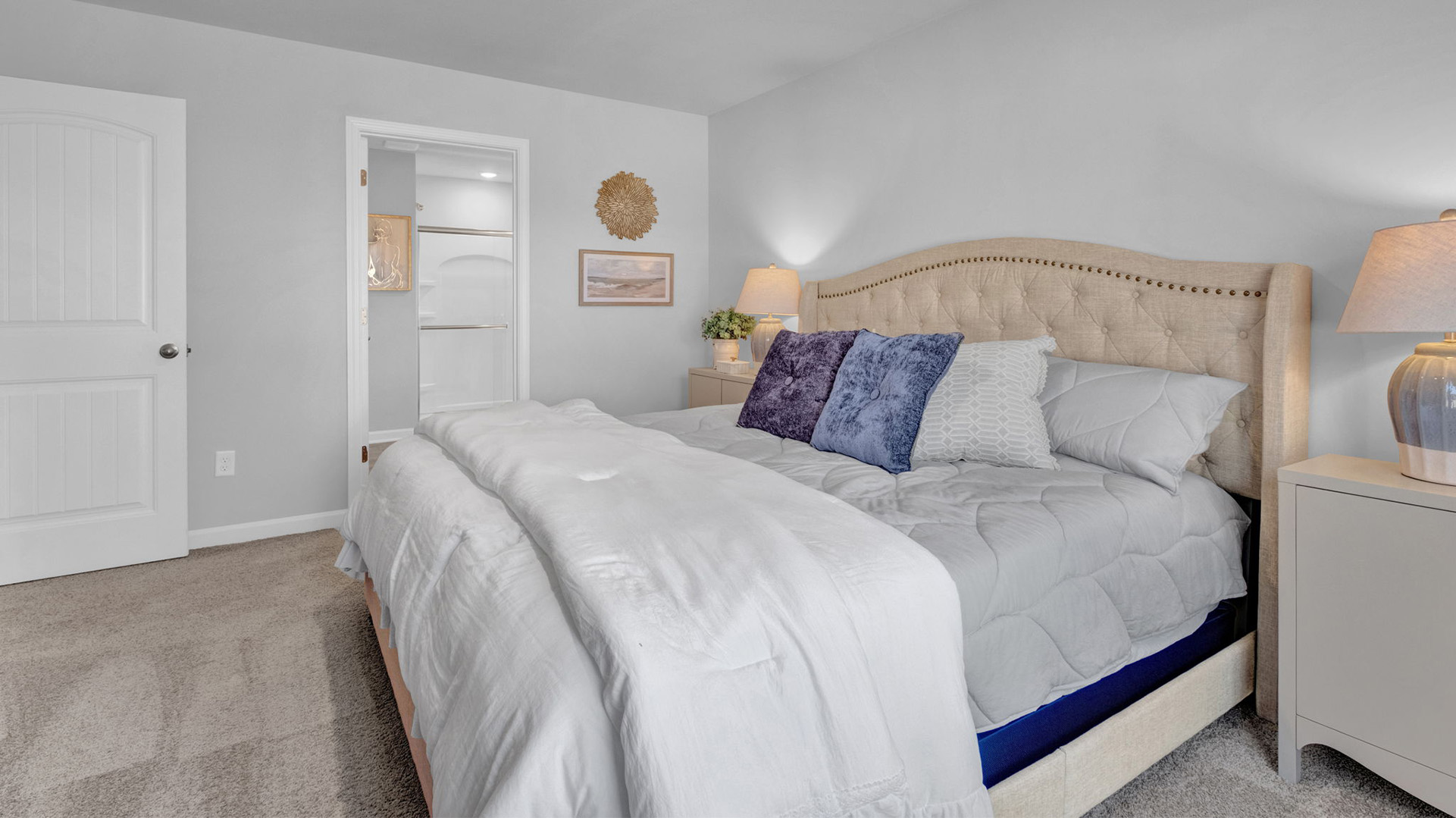 Primary bedroom comfortably fits additional bedroom furniture