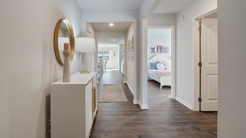 Front door entryway of the Aria floorplan, leading down the long entry hall