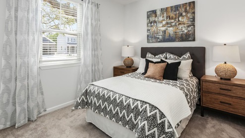 kerry plan second bedroom with carpet flooring in fitzgerald crossing community