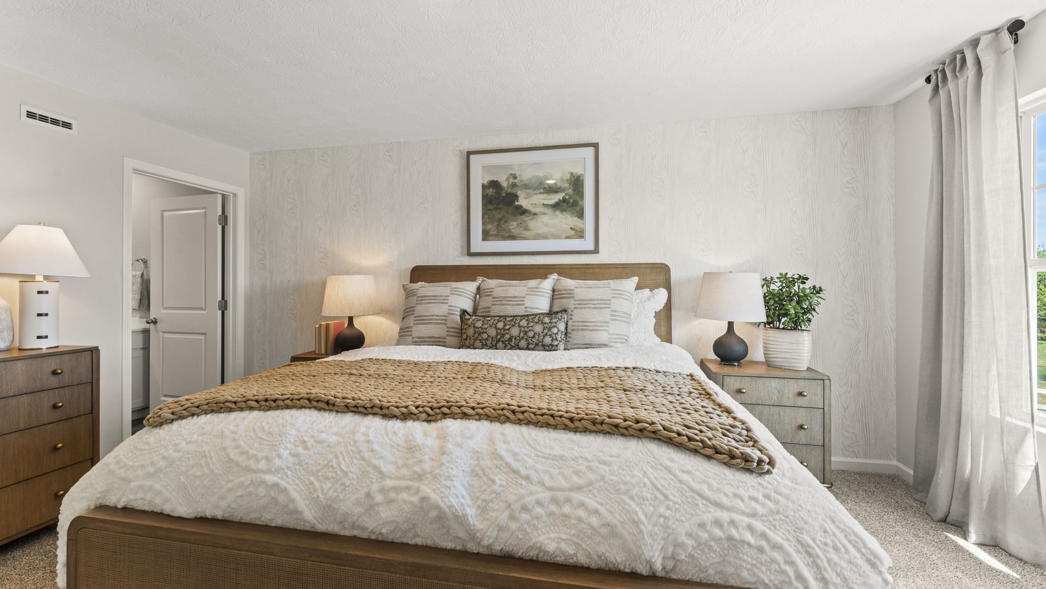 Primary bedroom comfortably fitting a king size bed