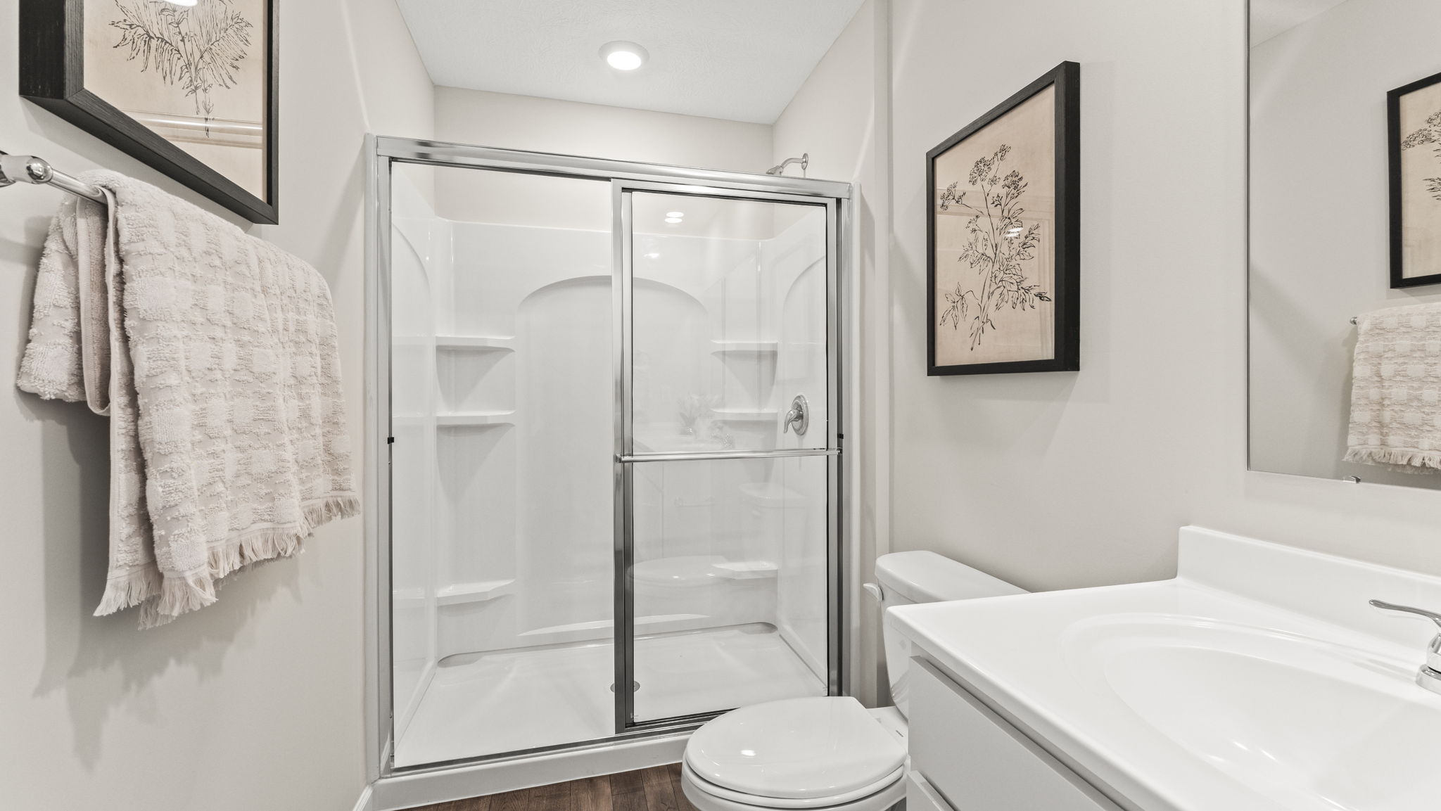 Glass enclosed walk in shower in the en suite