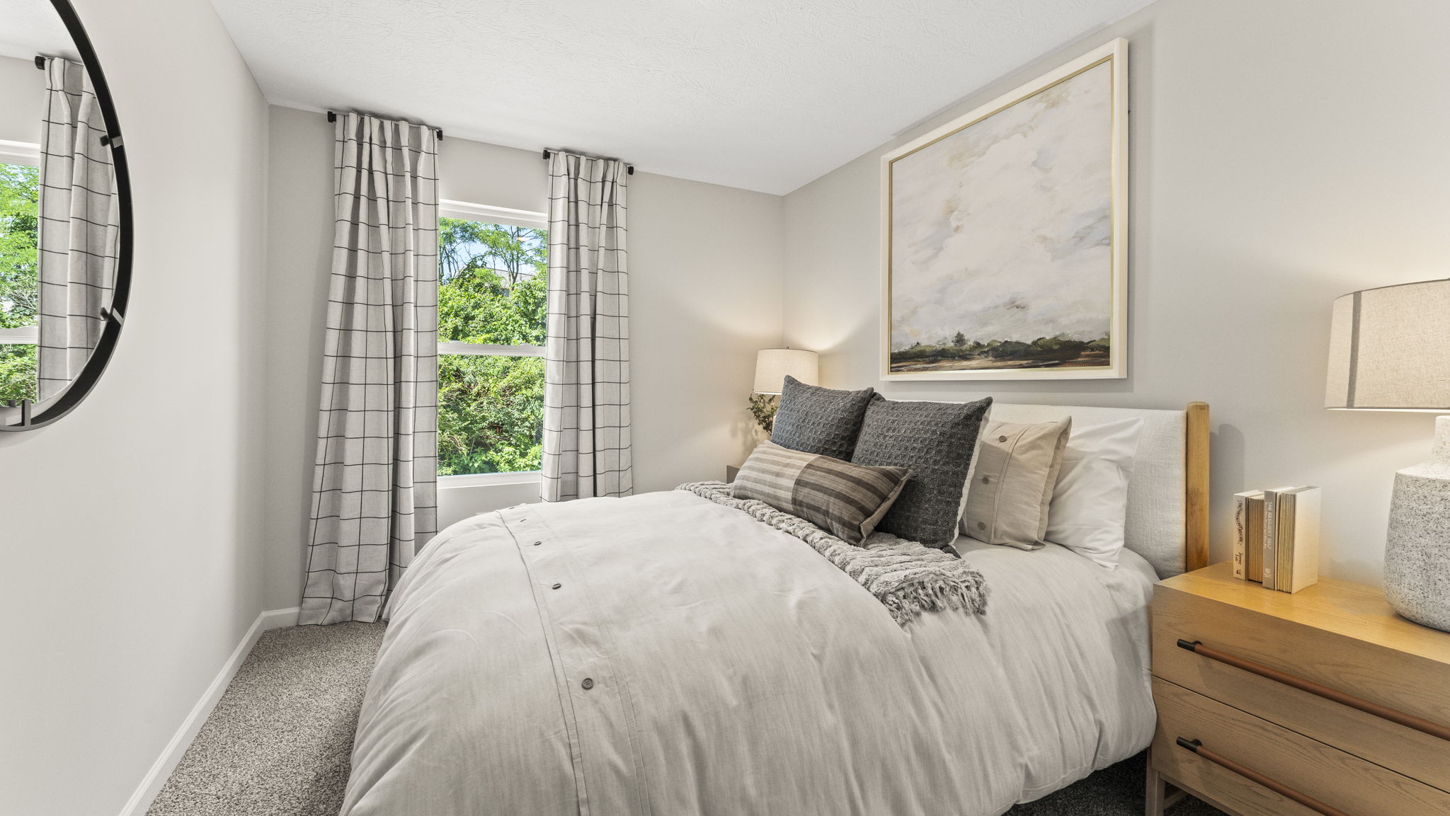 Third bedroom with a beautiful queen size bed and side table filling the space perfectly