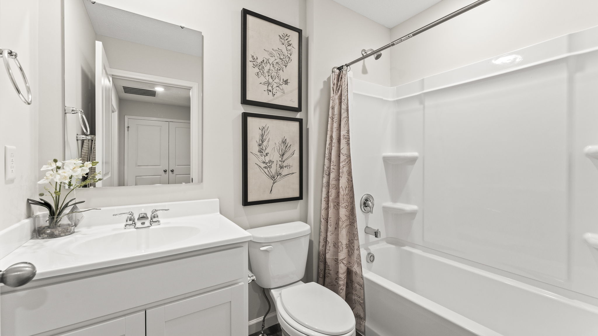 Second bathroom with a granite countertop single vanity