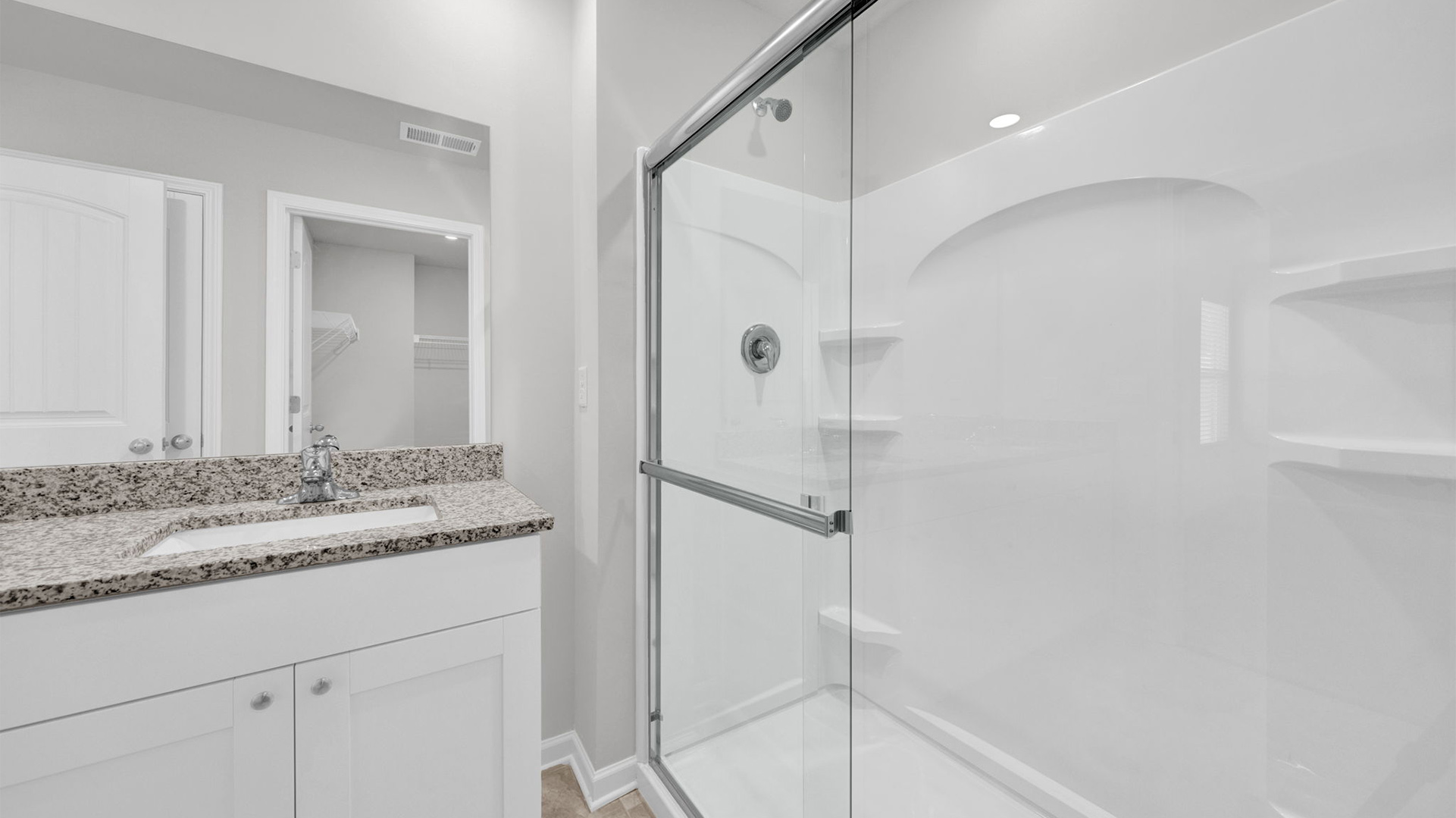 Glass enclosed walk in shower in en suite