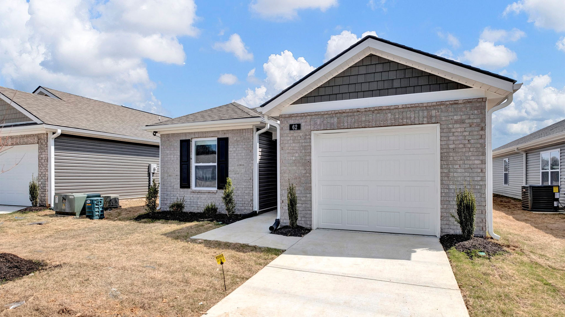 The exterior of the Greenbriar, a single story home with a single car garage