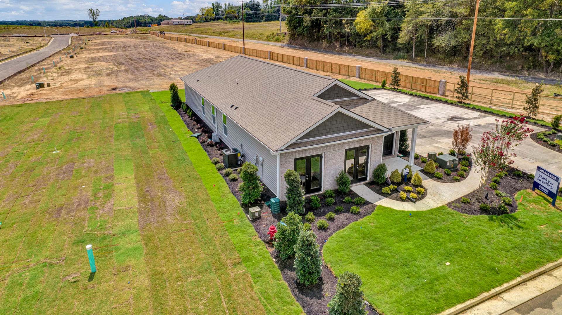 Side drone view of our model home at chickasaw Trails