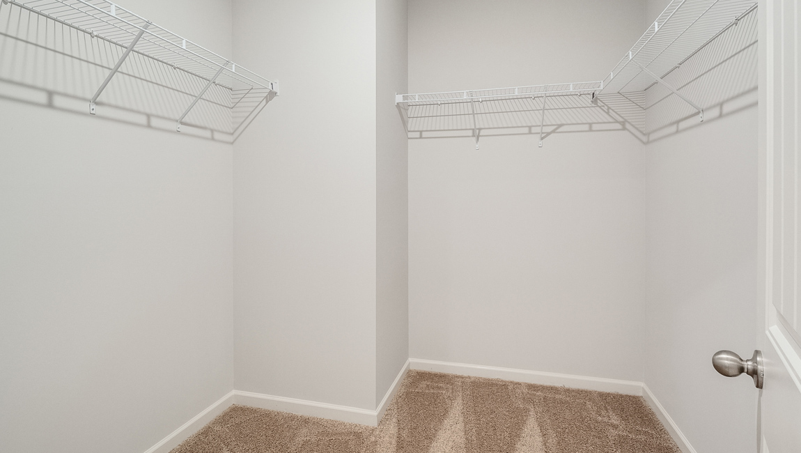 Primary closet with ventilated shelving