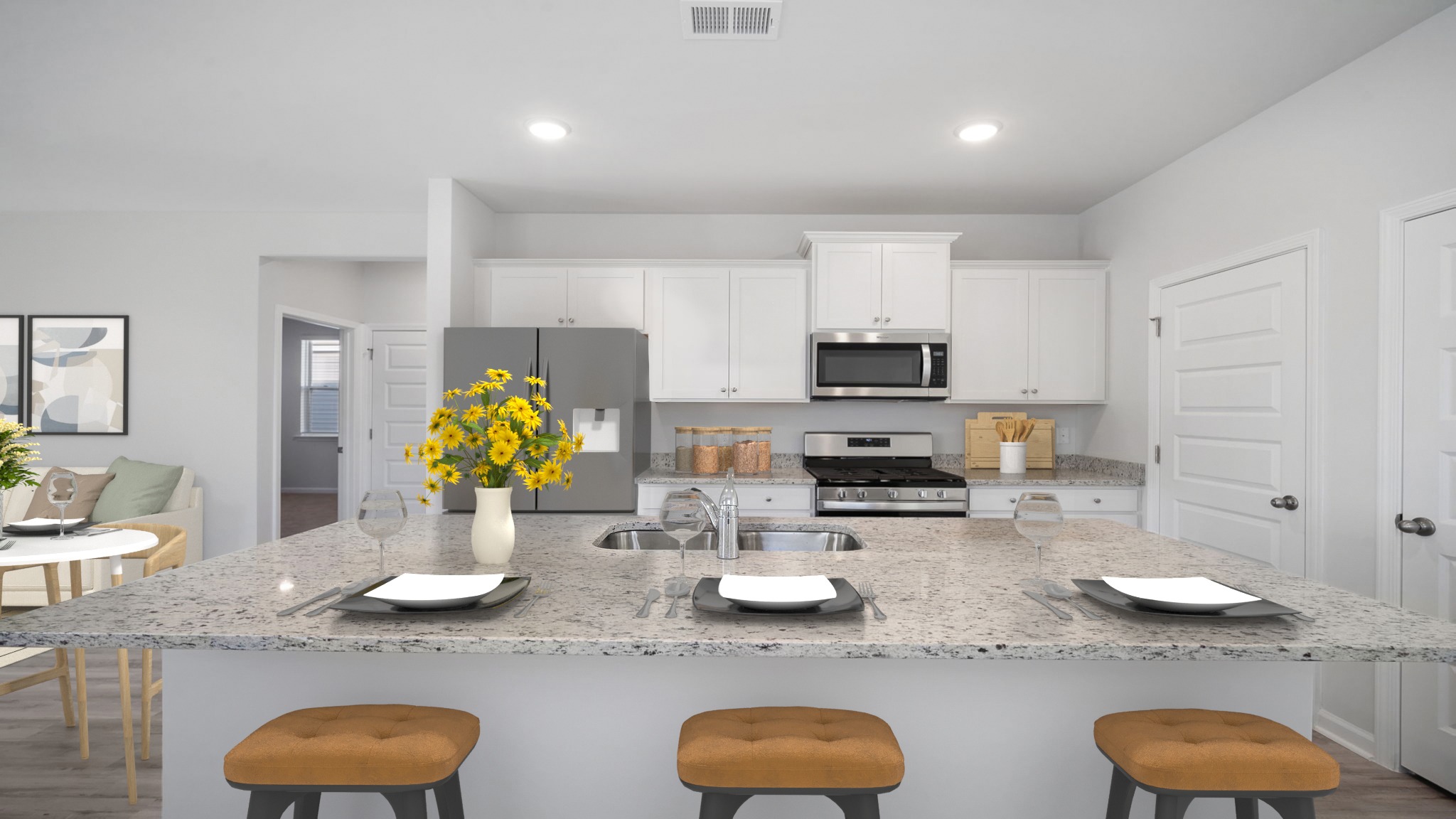 Kitchen with light cabinets and stainless steel appliances