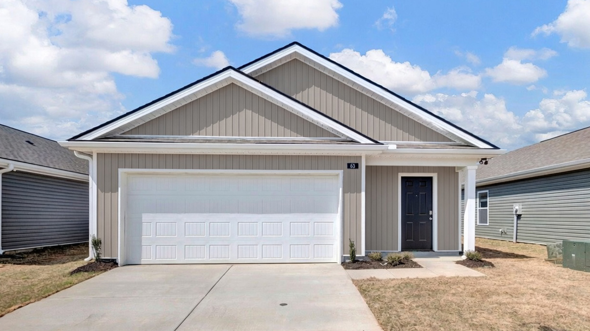 Exterior elevation of the Downing, a single story home with a two car garage