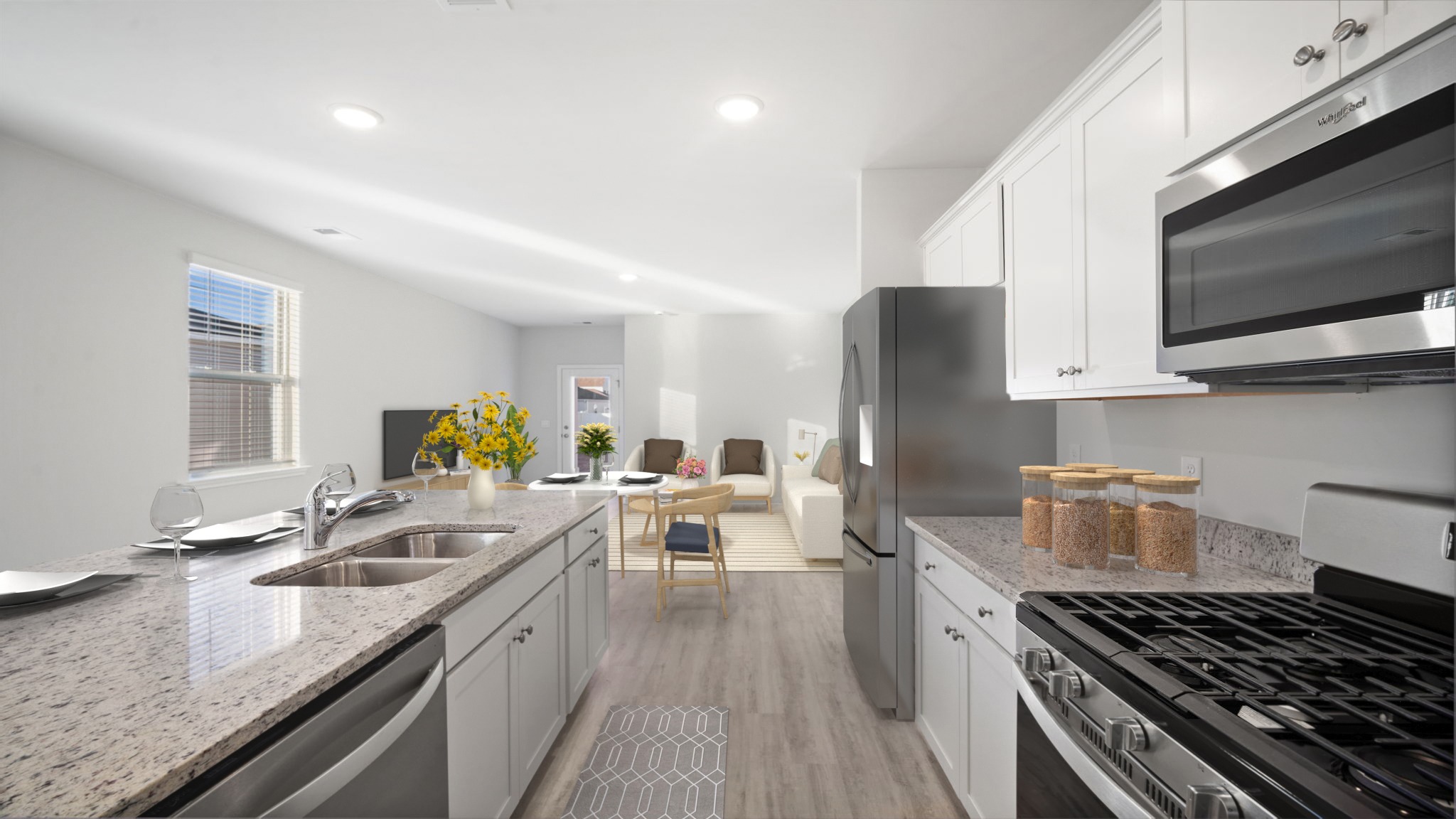 Kitchen area with stainless steel appliances and granite counter tops