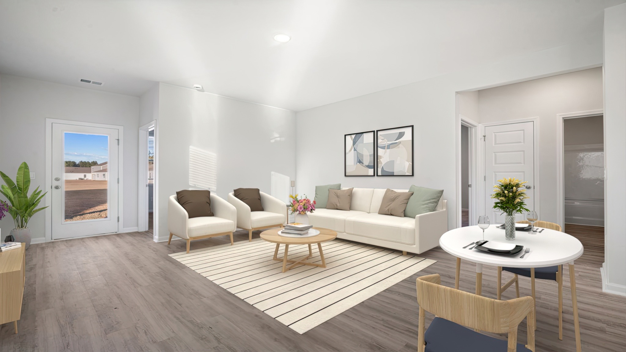 Spacious living room area with neutral walls and revwood vinyl flooring